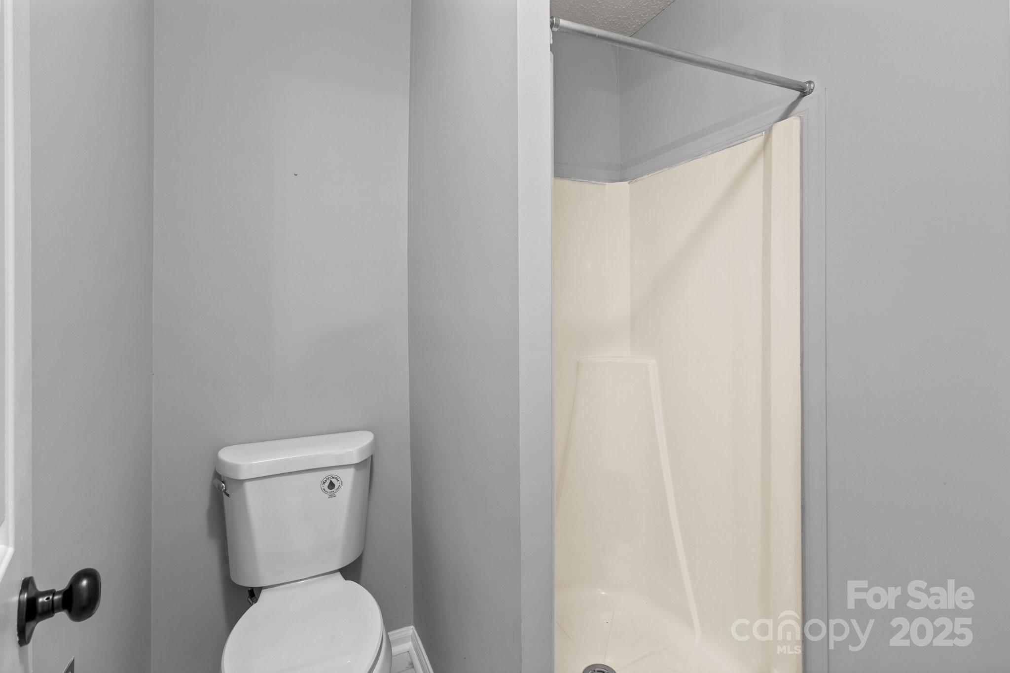 140 Lake Concord Road Northeast, Unit D9 Concord, NC 28025 - Photo 14 of 28 a white toilet sitting next to a white wall