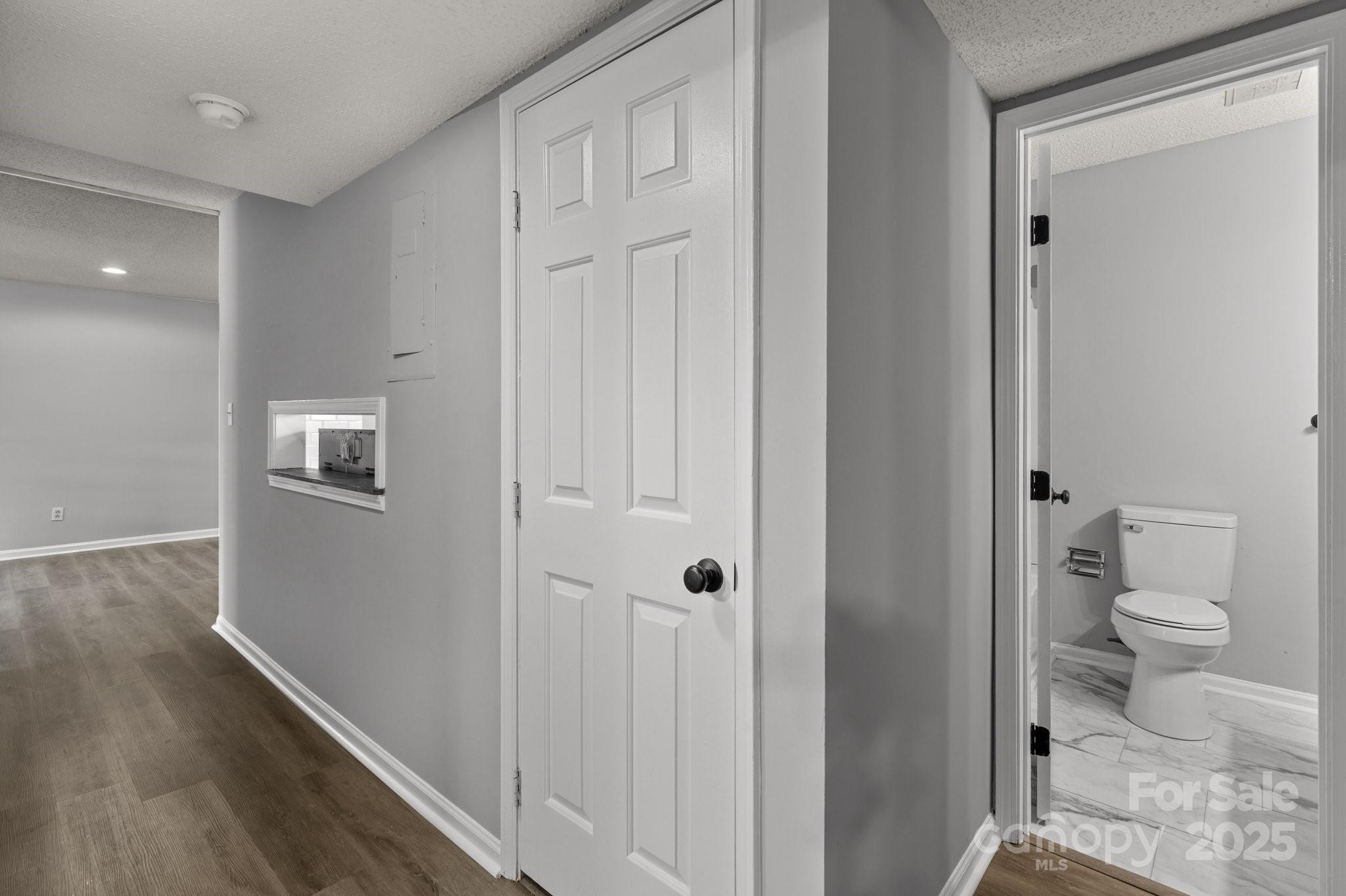 140 Lake Concord Road Northeast, Unit D9 Concord, NC 28025 - Photo 15 of 28 a bathroom with a toilet and a shower