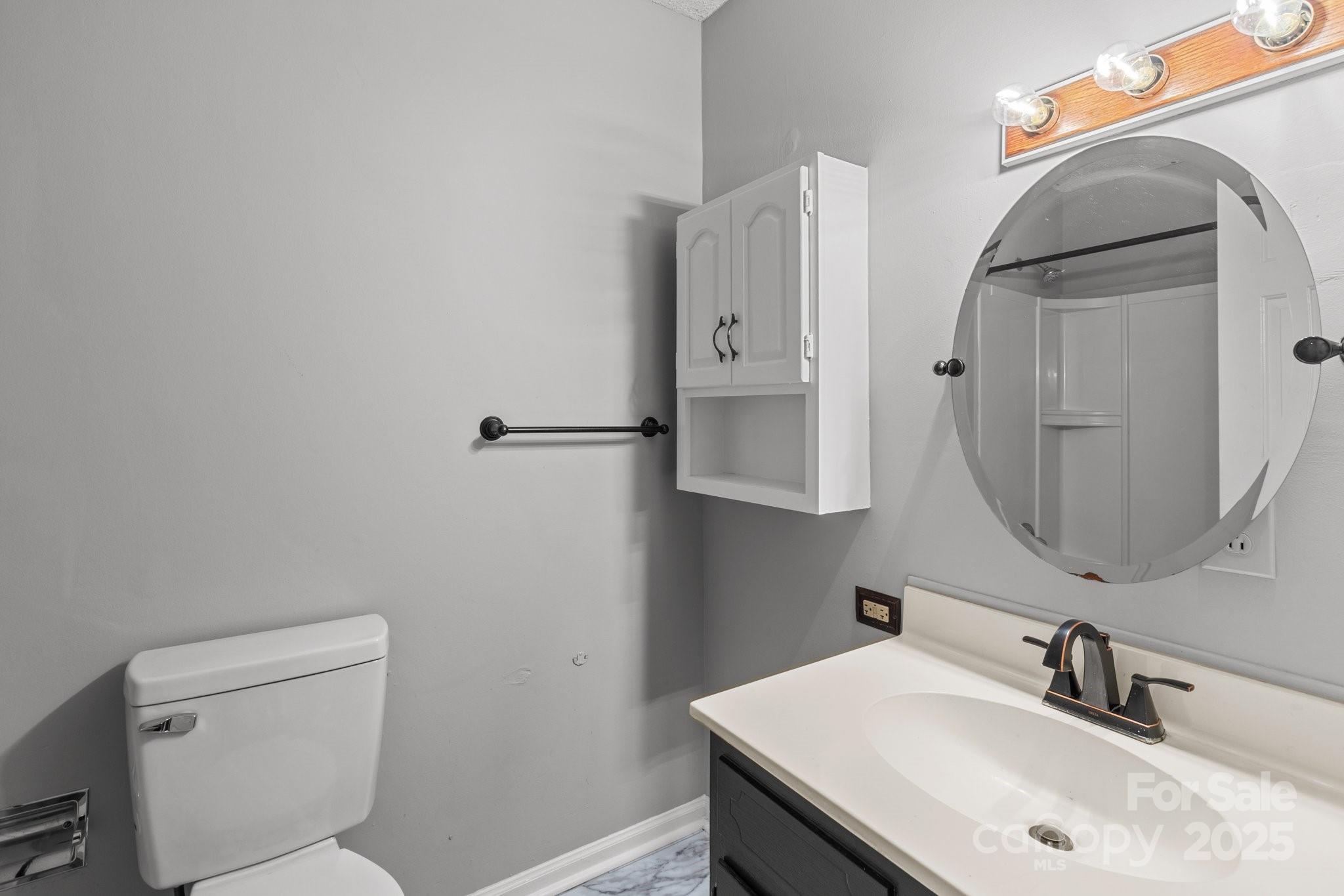140 Lake Concord Road Northeast, Unit D9 Concord, NC 28025 - Photo 16 of 28 a bathroom with a sink toilet and vanity