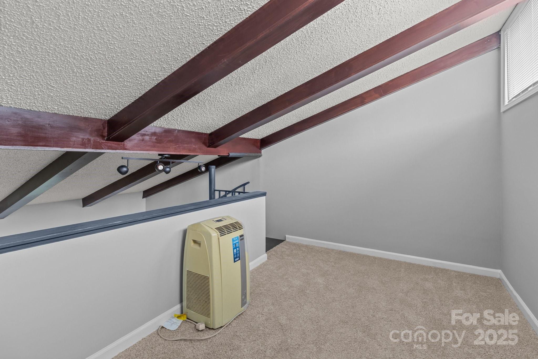 140 Lake Concord Road Northeast, Unit D9 Concord, NC 28025 - Photo 21 of 28 a view of a room with wooden floor