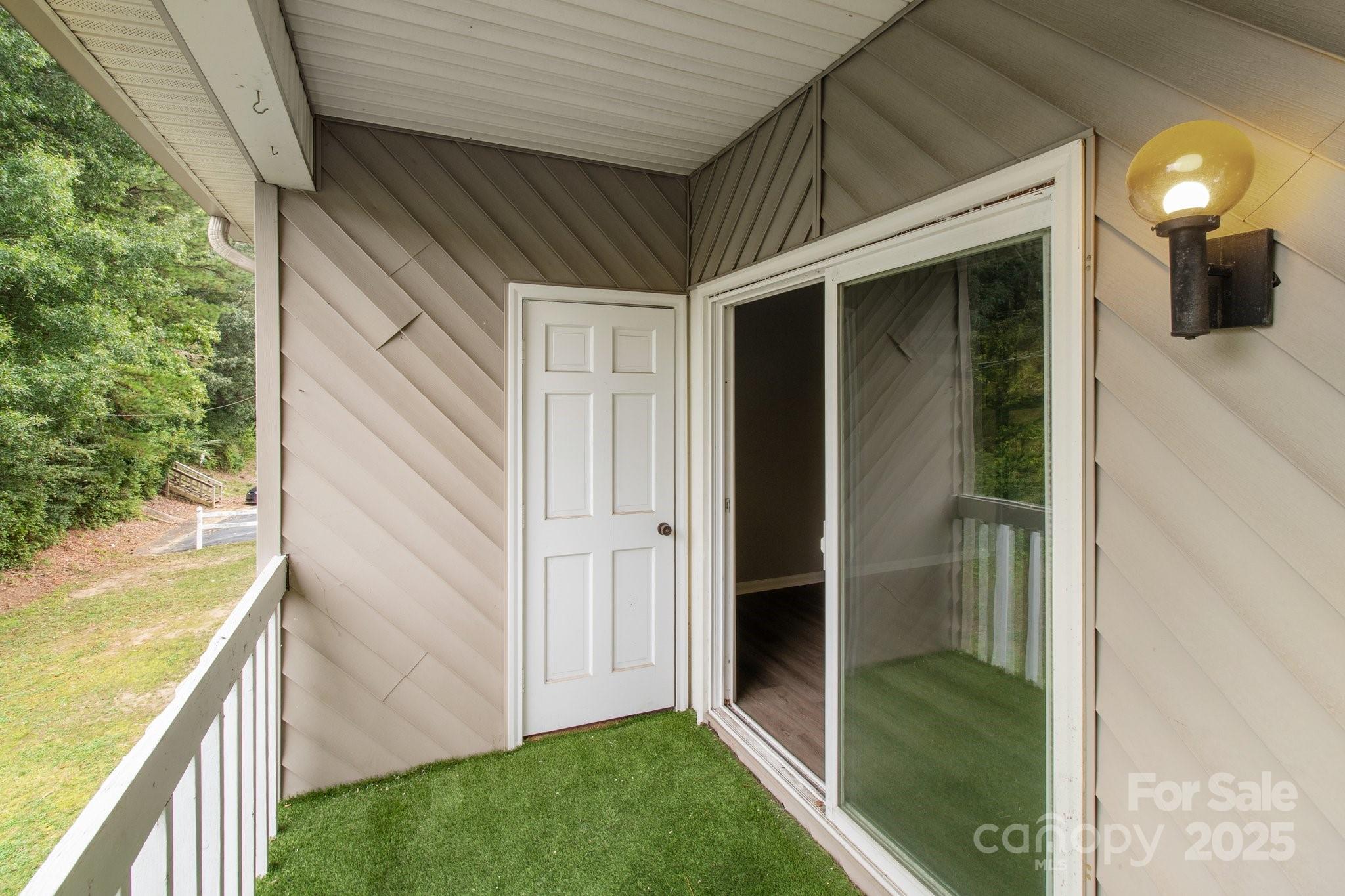 140 Lake Concord Road Northeast, Unit D9 Concord, NC 28025 - Photo 22 of 28 a view of a porch of the house