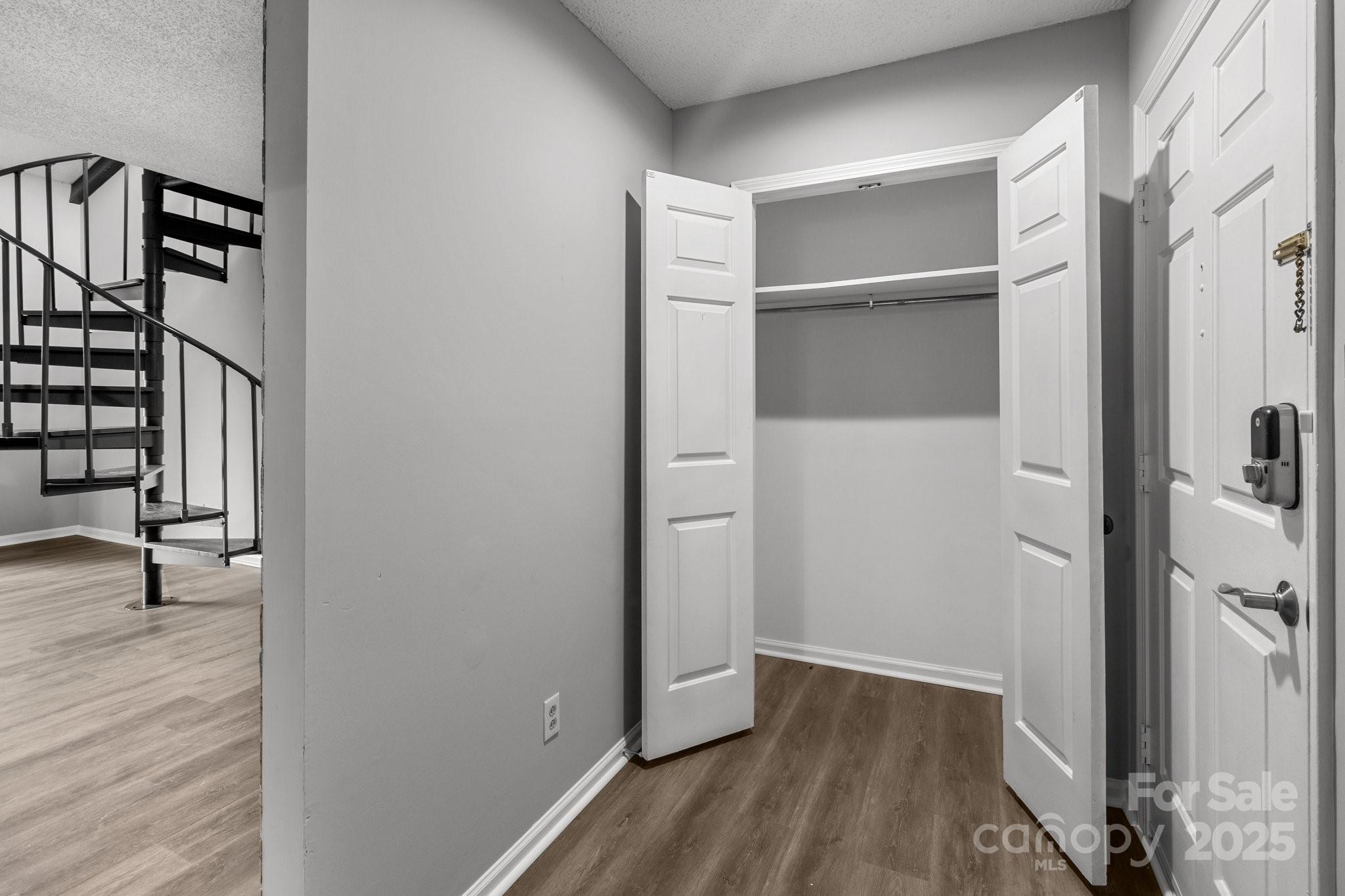 140 Lake Concord Road Northeast, Unit D9 Concord, NC 28025 - Photo 5 of 28 a view of empty room with wooden floor