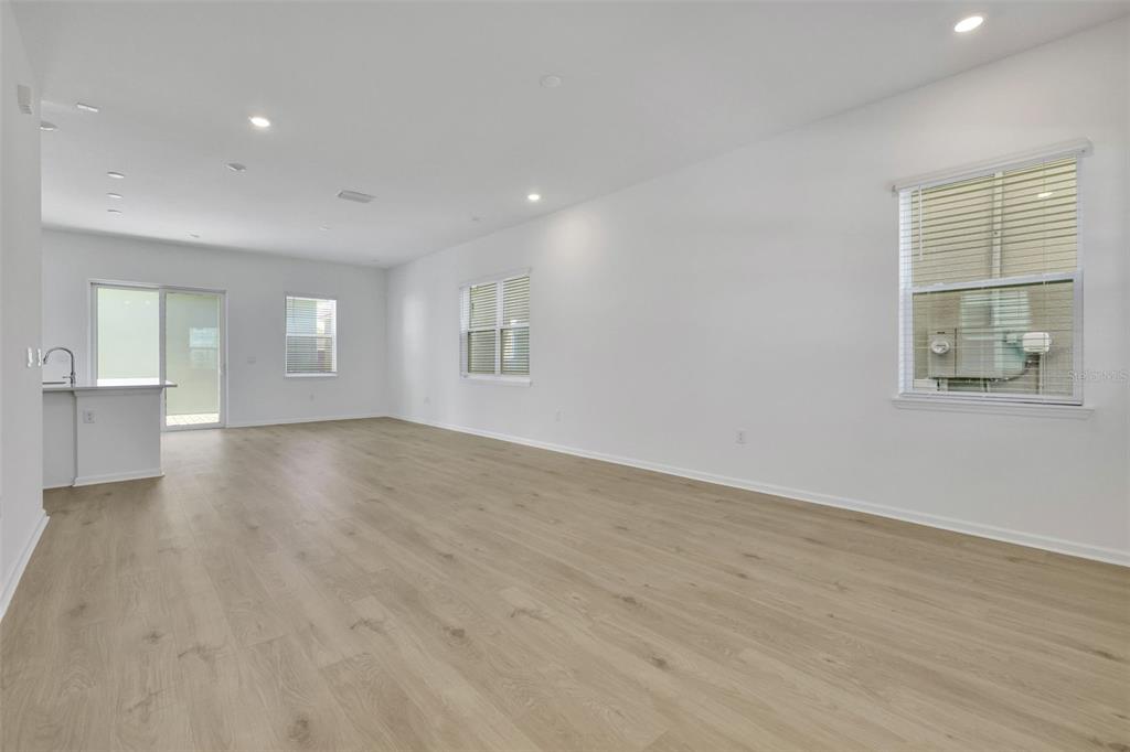 13013 Serene Glade Road Winter Garden, FL 34787 - Photo 17 of 57 a view of empty room with wooden floor and fan