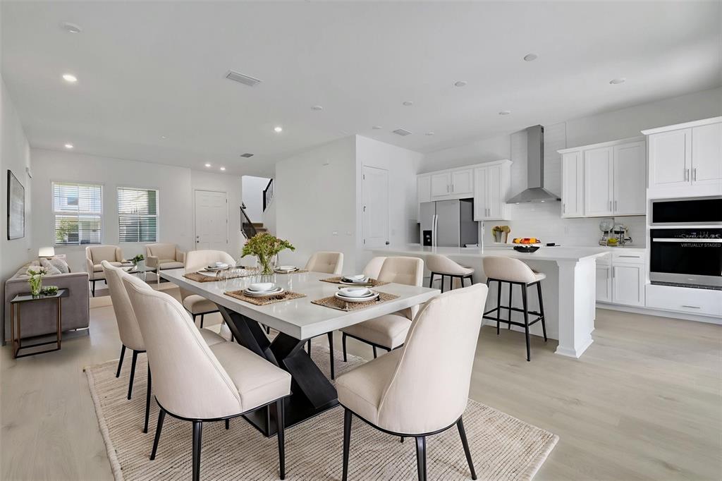 13013 Serene Glade Road Winter Garden, FL 34787 - Photo 24 of 57 a view of a dining room with furniture