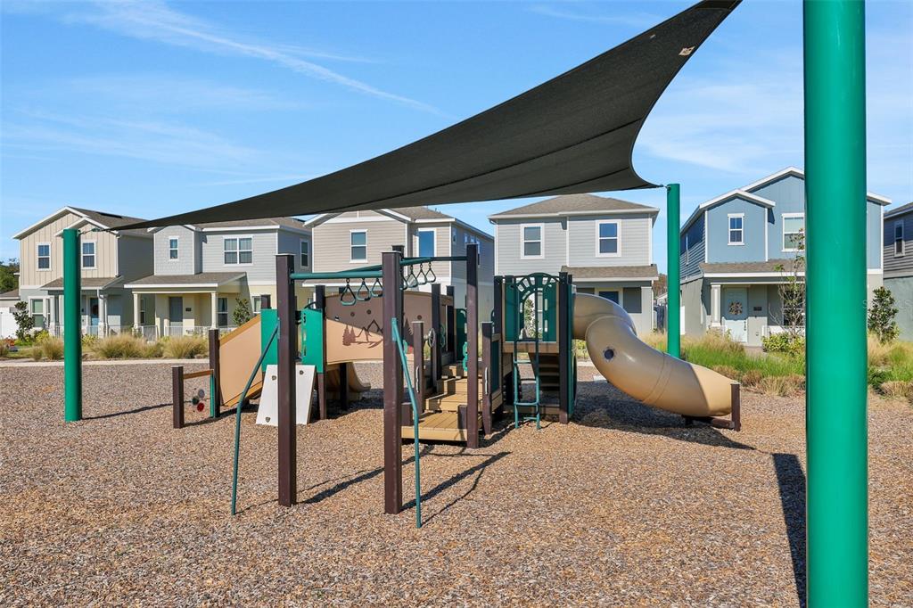 13013 Serene Glade Road Winter Garden, FL 34787 - Photo 54 of 57 a view of a house with a backyard and porch