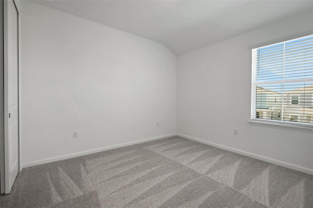 13013 Serene Glade Road Winter Garden, FL 34787 - Photo 6 of 57 an empty room with a window