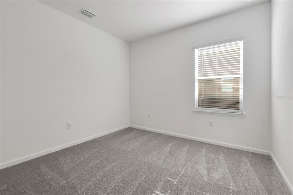 13013 Serene Glade Road Winter Garden, FL 34787 - Photo 8 of 57 an empty room with a window