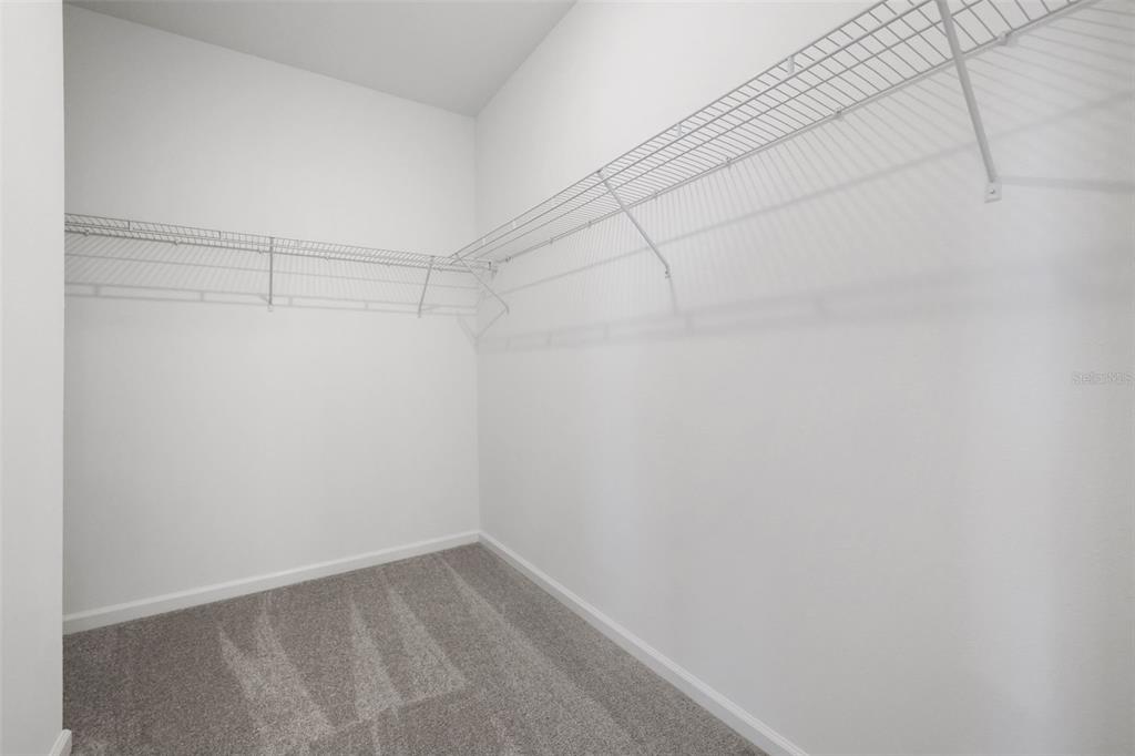 13013 Serene Glade Road Winter Garden, FL 34787 - Photo 9 of 57 a view of a room with racks on the wall