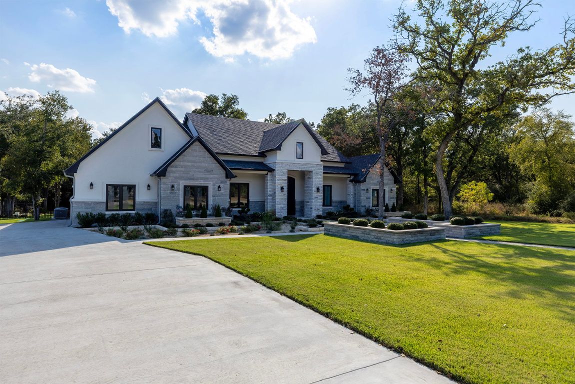 153 Fawn Hollow Elgin, TX 78621 - Photo 3 of 40 Modern farmhouse style home featuring a front yard and stone siding