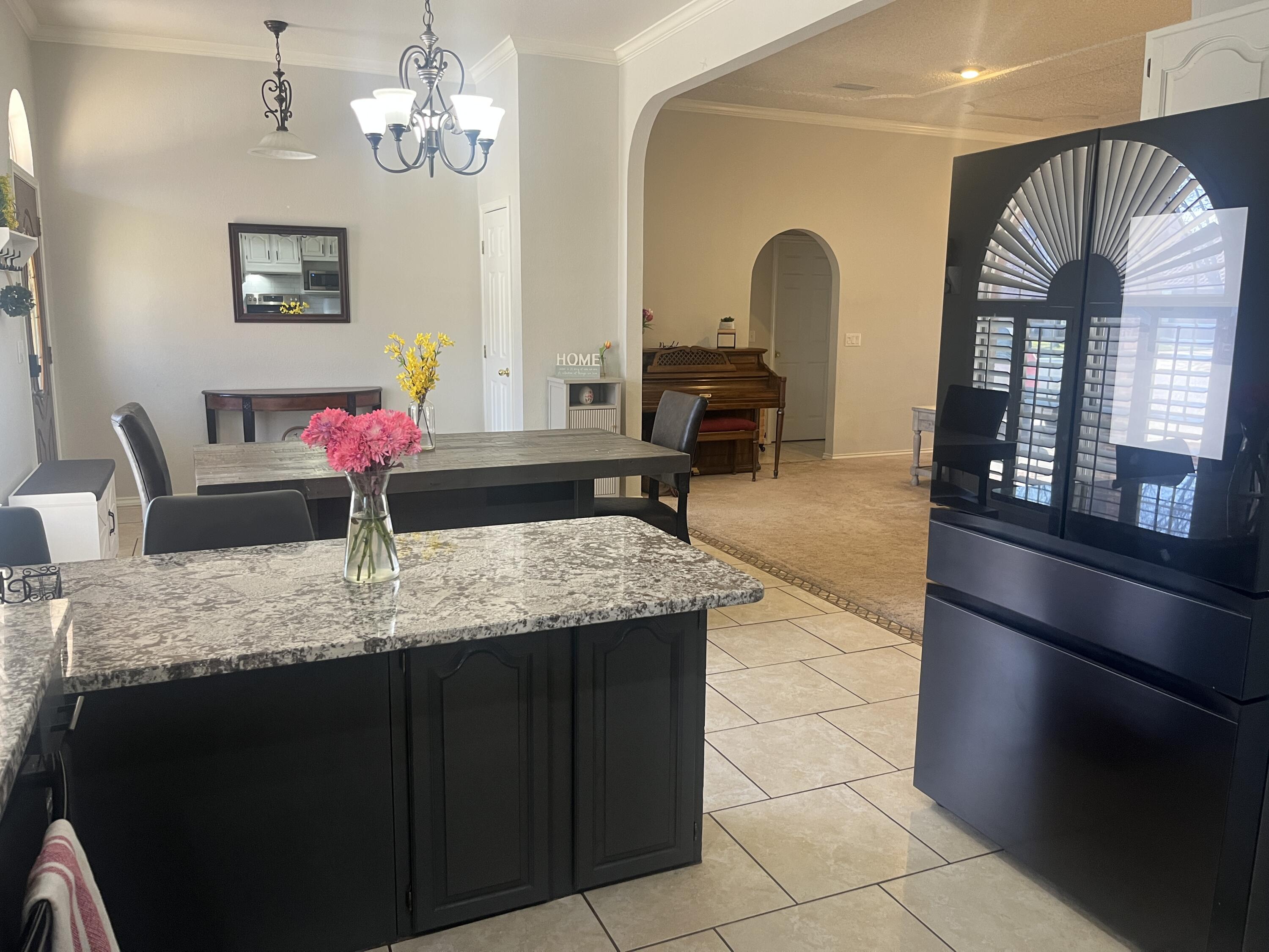 2222 South 2nd Place Lamesa, TX 79331 - Photo 17 of 44 a bathroom with a granite countertop sink a mirror and vanity