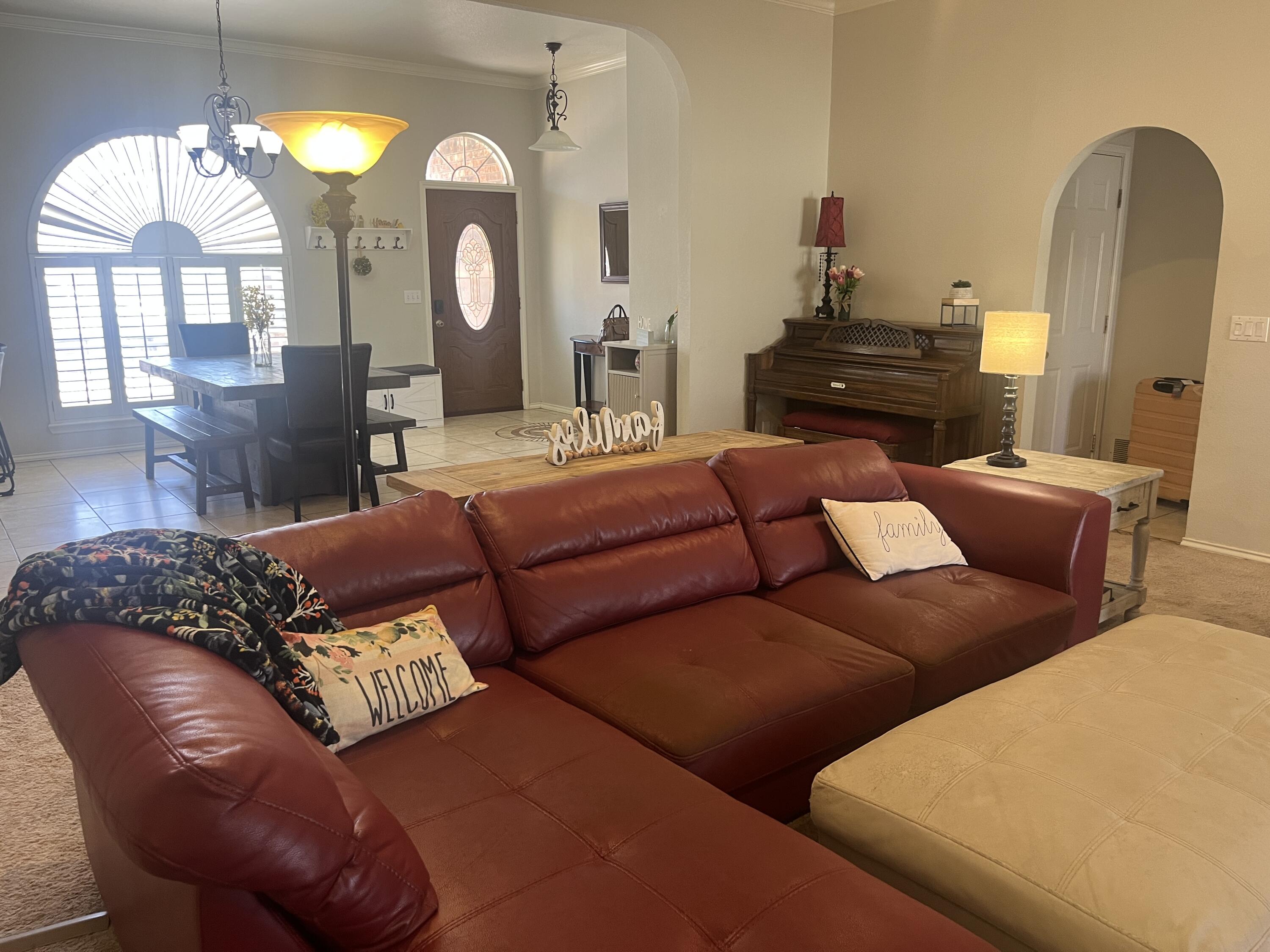 2222 South 2nd Place Lamesa, TX 79331 - Photo 2 of 44 a living room with furniture and a mirror