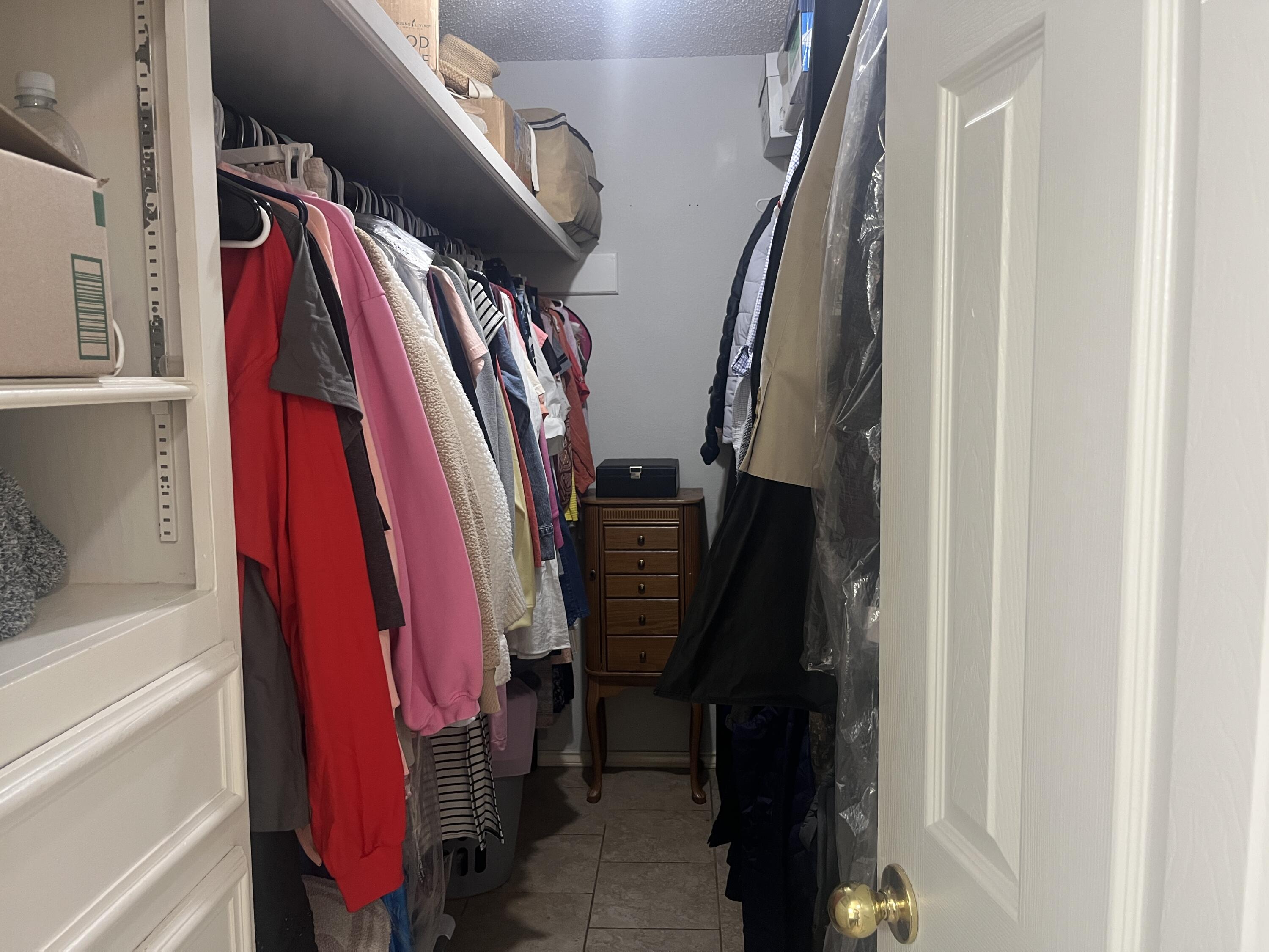 2222 South 2nd Place Lamesa, TX 79331 - Photo 25 of 44 a view of walk in closet with clothes and shoes