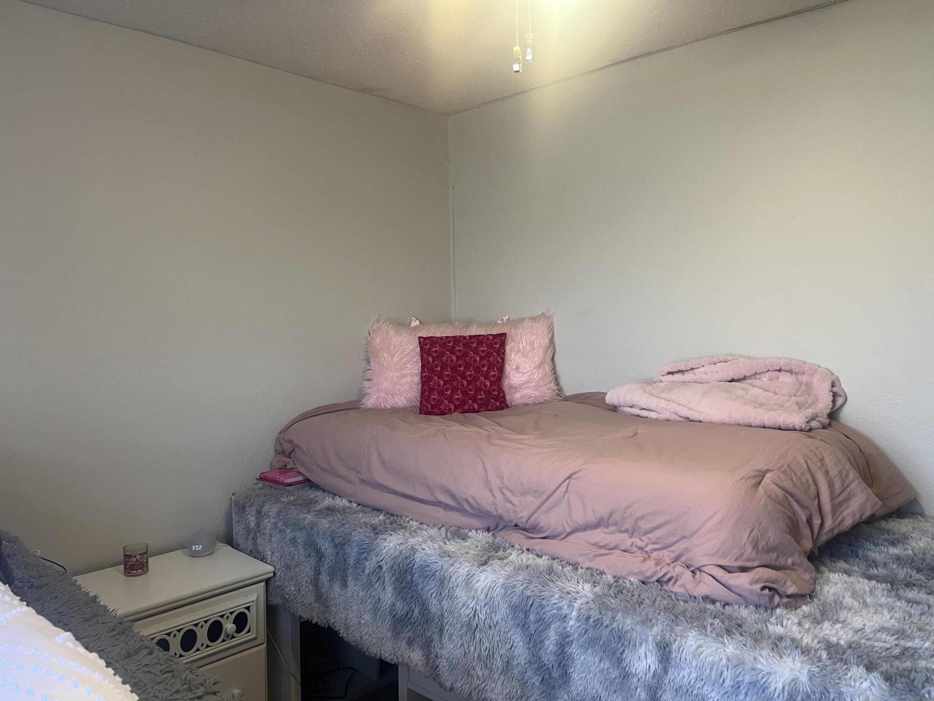 2222 South 2nd Place Lamesa, TX 79331 - Photo 28 of 44 a bedroom with a bed and a tv