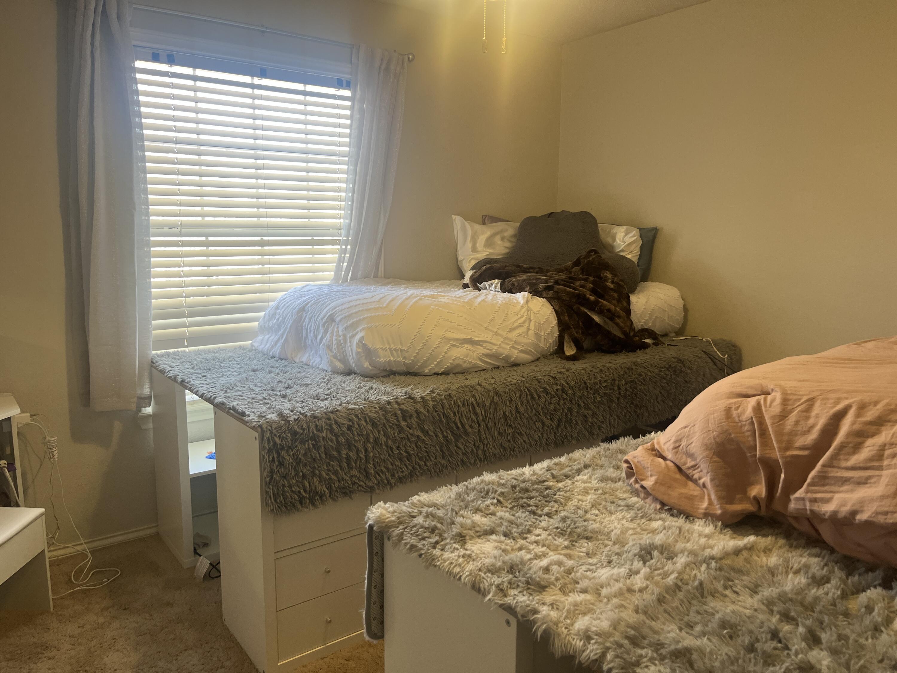 2222 South 2nd Place Lamesa, TX 79331 - Photo 29 of 44 a bedroom with bed and window