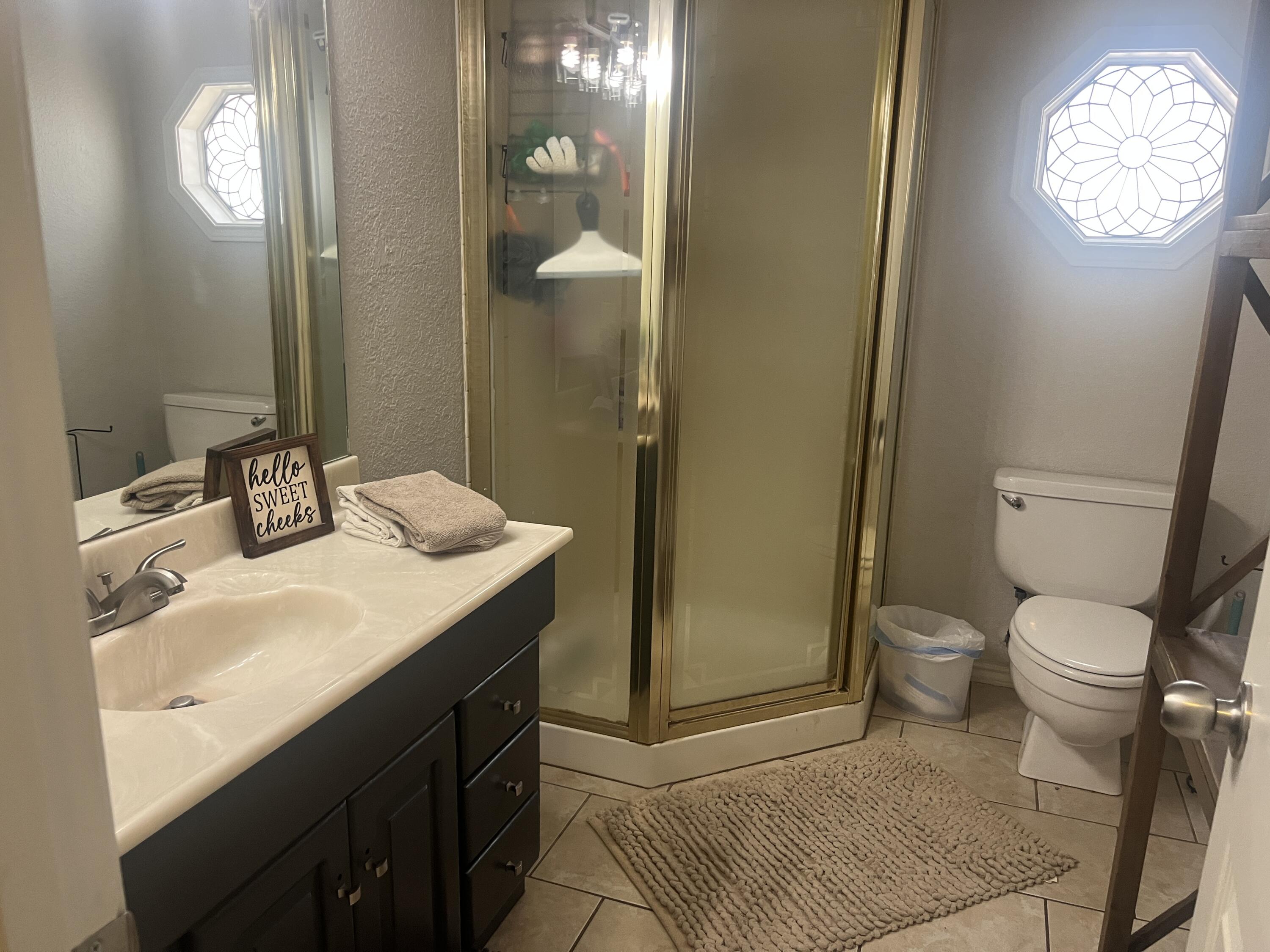 2222 South 2nd Place Lamesa, TX 79331 - Photo 32 of 44 a bathroom with a sink a toilet and a mirror