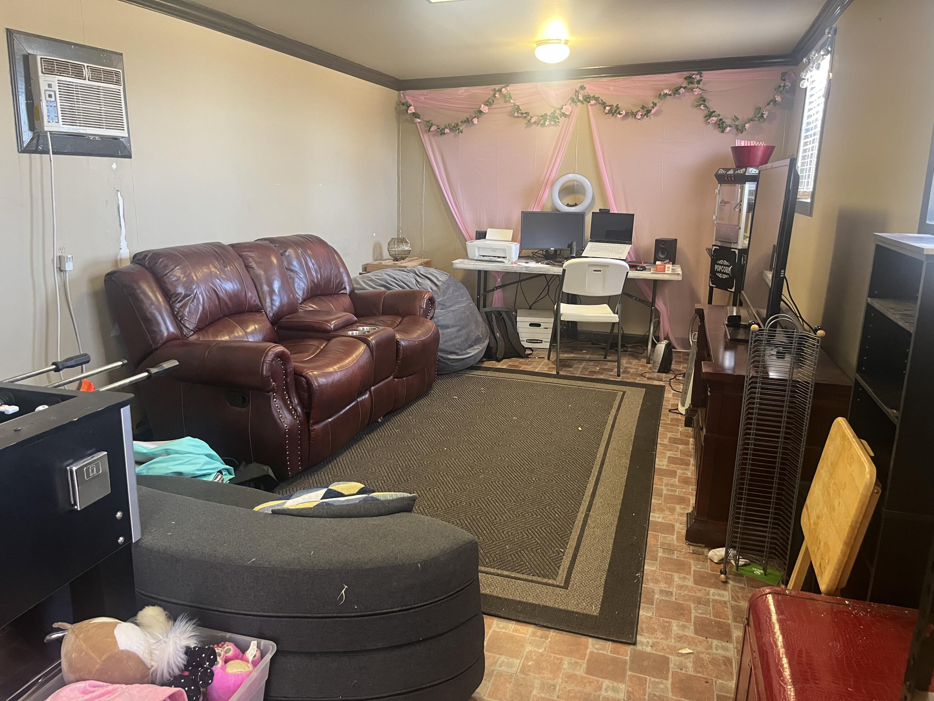 2222 South 2nd Place Lamesa, TX 79331 - Photo 43 of 44 a living room with furniture and a flat screen tv