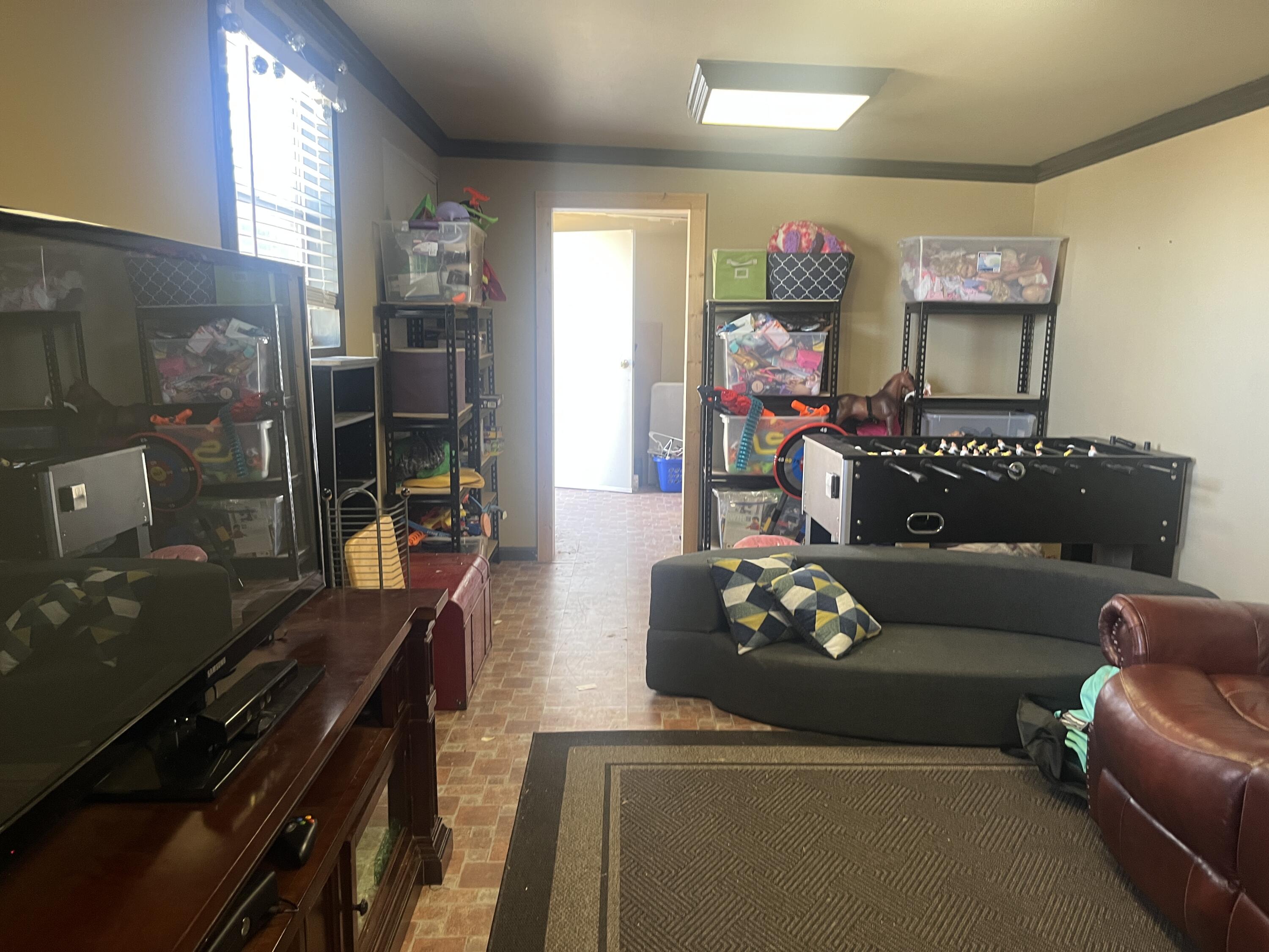 2222 South 2nd Place Lamesa, TX 79331 - Photo 44 of 44 a living room with furniture and a flat screen tv