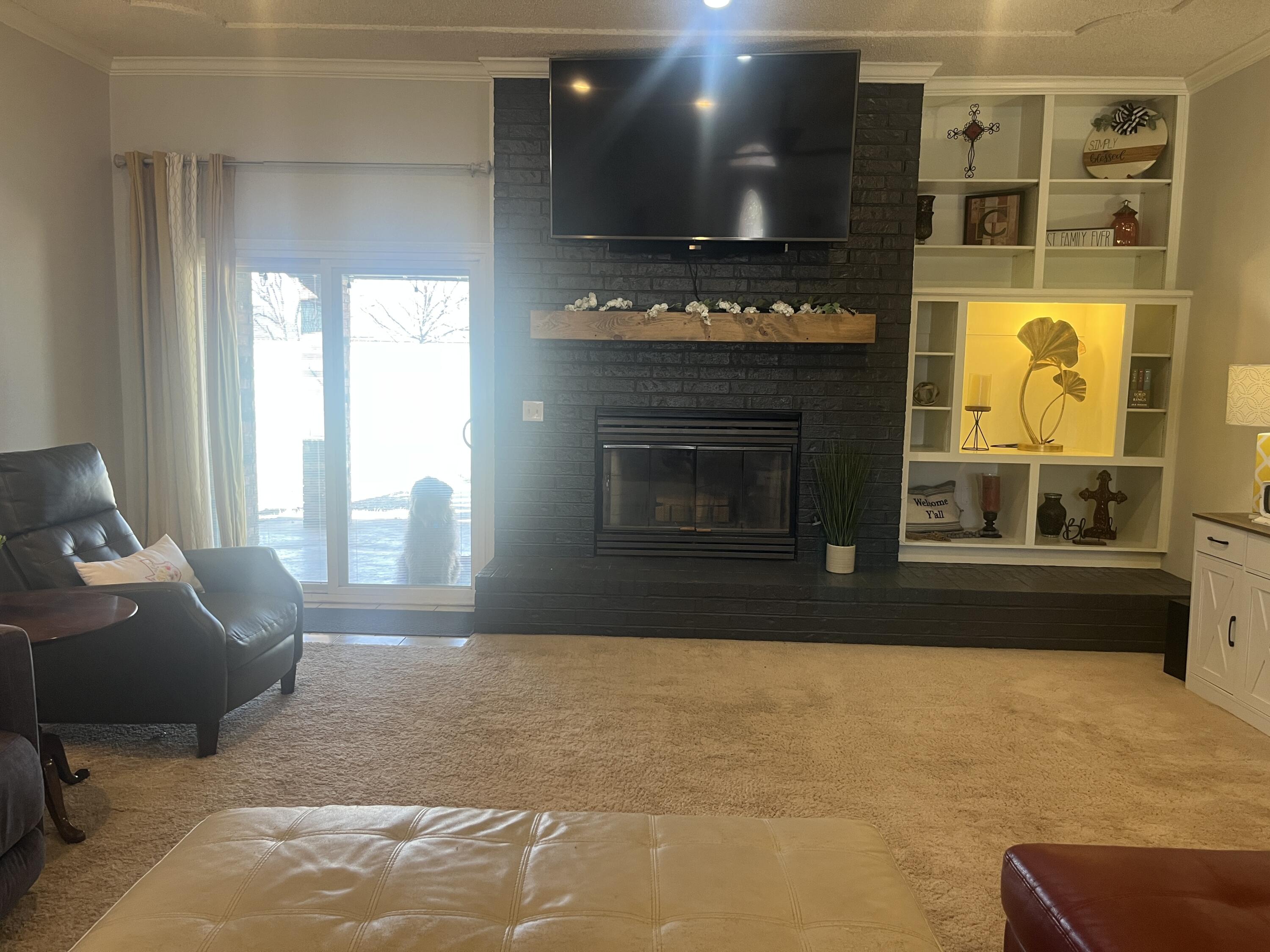 2222 South 2nd Place Lamesa, TX 79331 - Photo 5 of 44 a living room with furniture and a fireplace