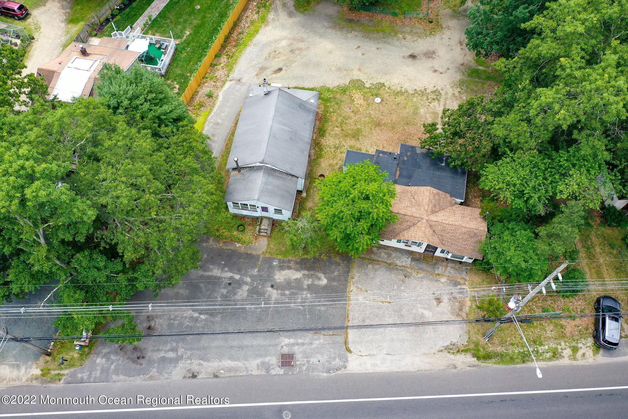 1350 Toms River Road Jackson, NJ 08527 - Photo 1 of 20 an aerial view of a house with a yard and large trees