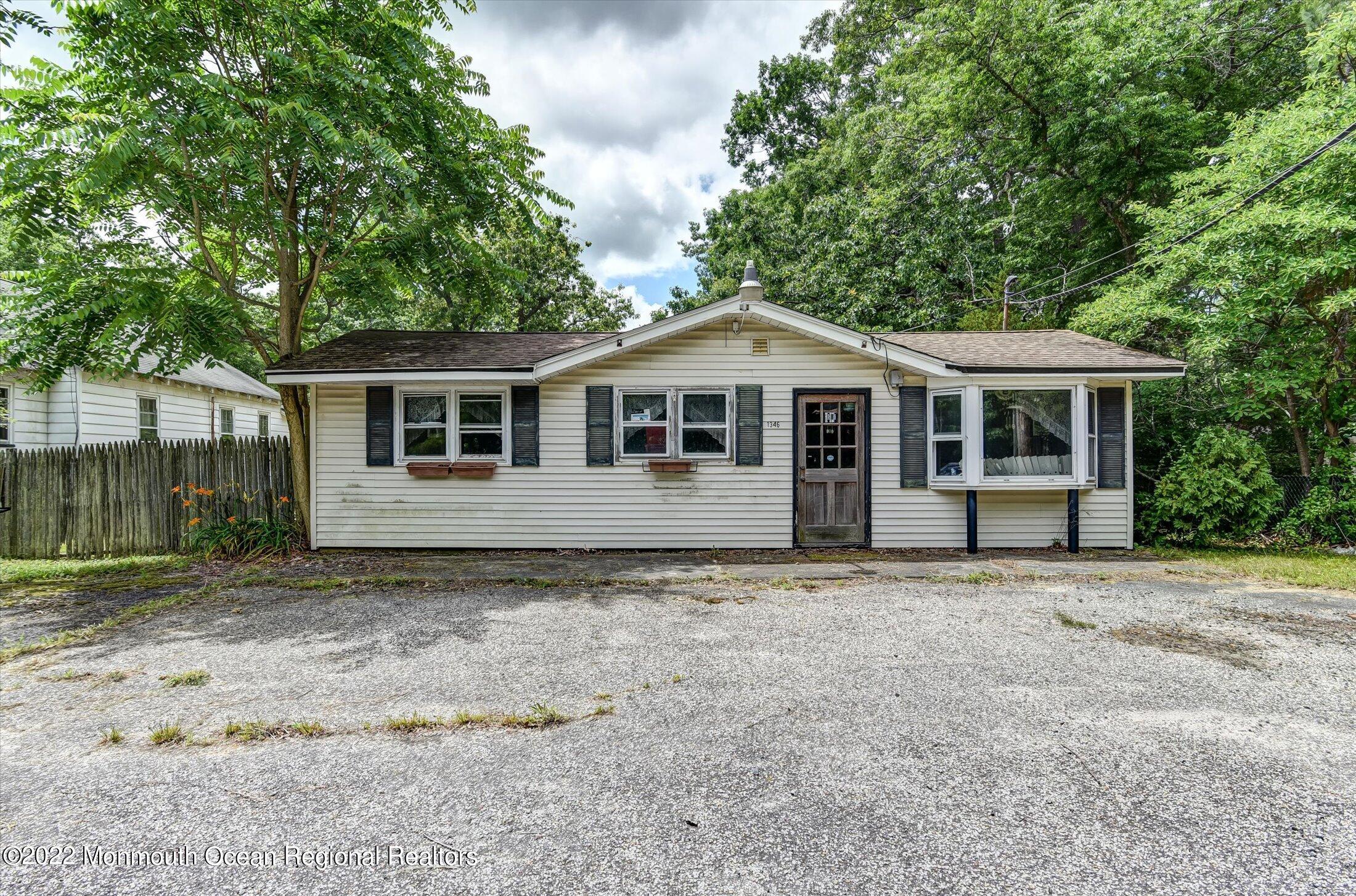1350 Toms River Road Jackson, NJ 08527 - Photo 13 of 20 a front view of a house with a garden