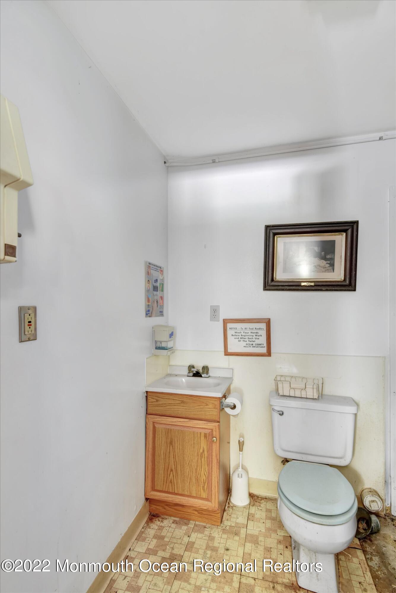 1350 Toms River Road Jackson, NJ 08527 - Photo 17 of 20 a bathroom with a toilet a sink and a mirror