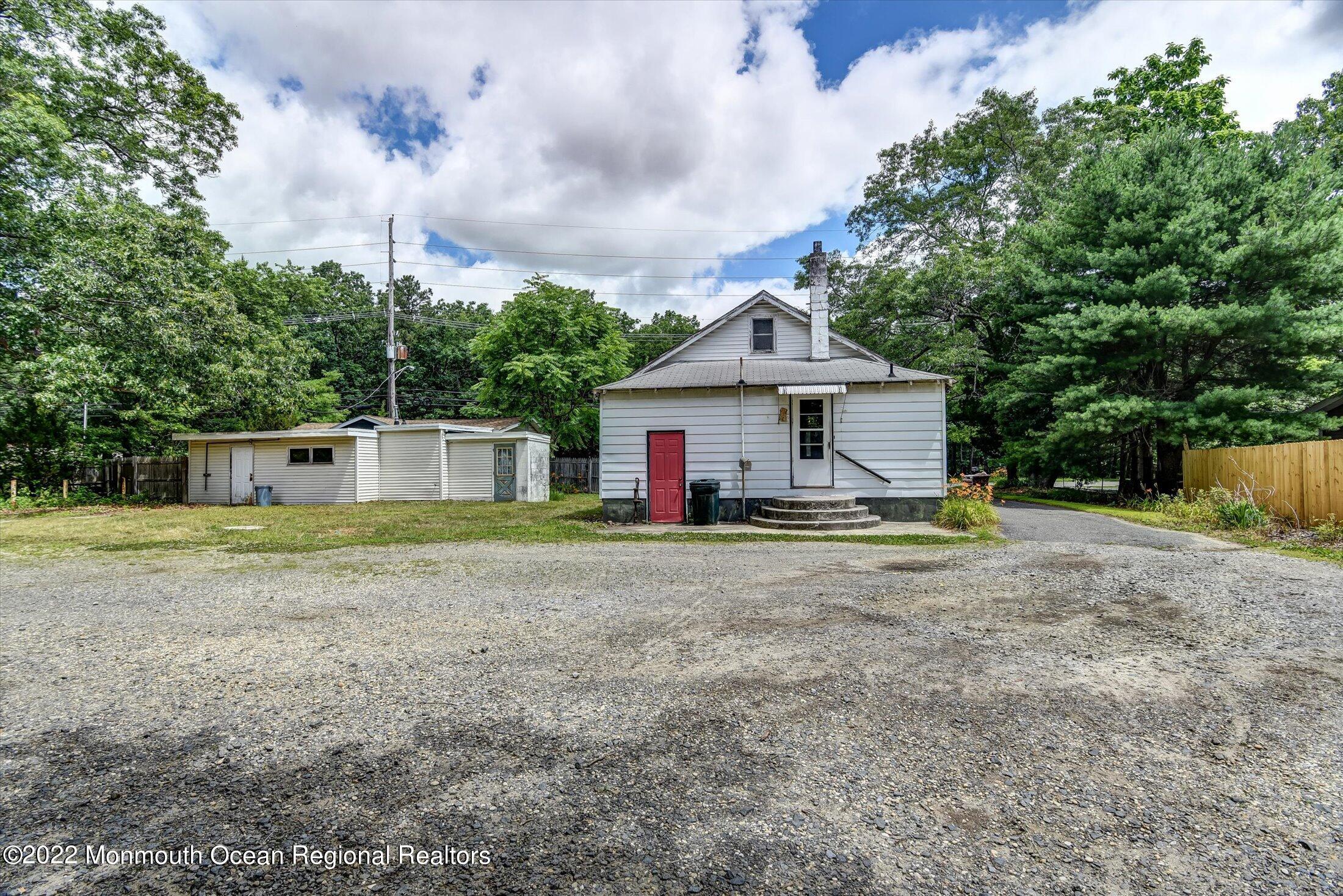 1350 Toms River Road Jackson, NJ 08527 - Photo 18 of 20 a front view of a house with a yard and trees