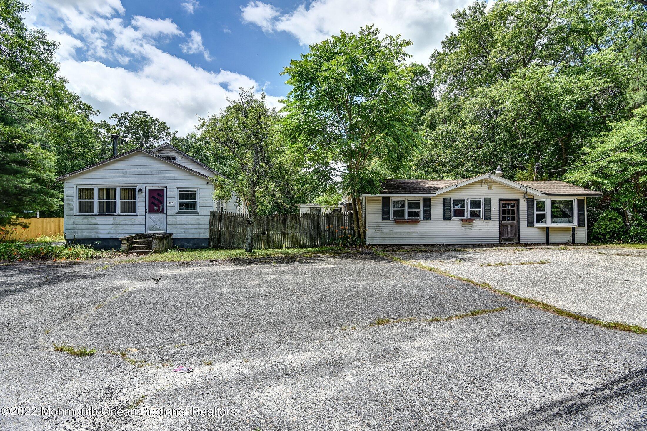 1350 Toms River Road Jackson, NJ 08527 - Photo 2 of 20 a front view of a house with a garden