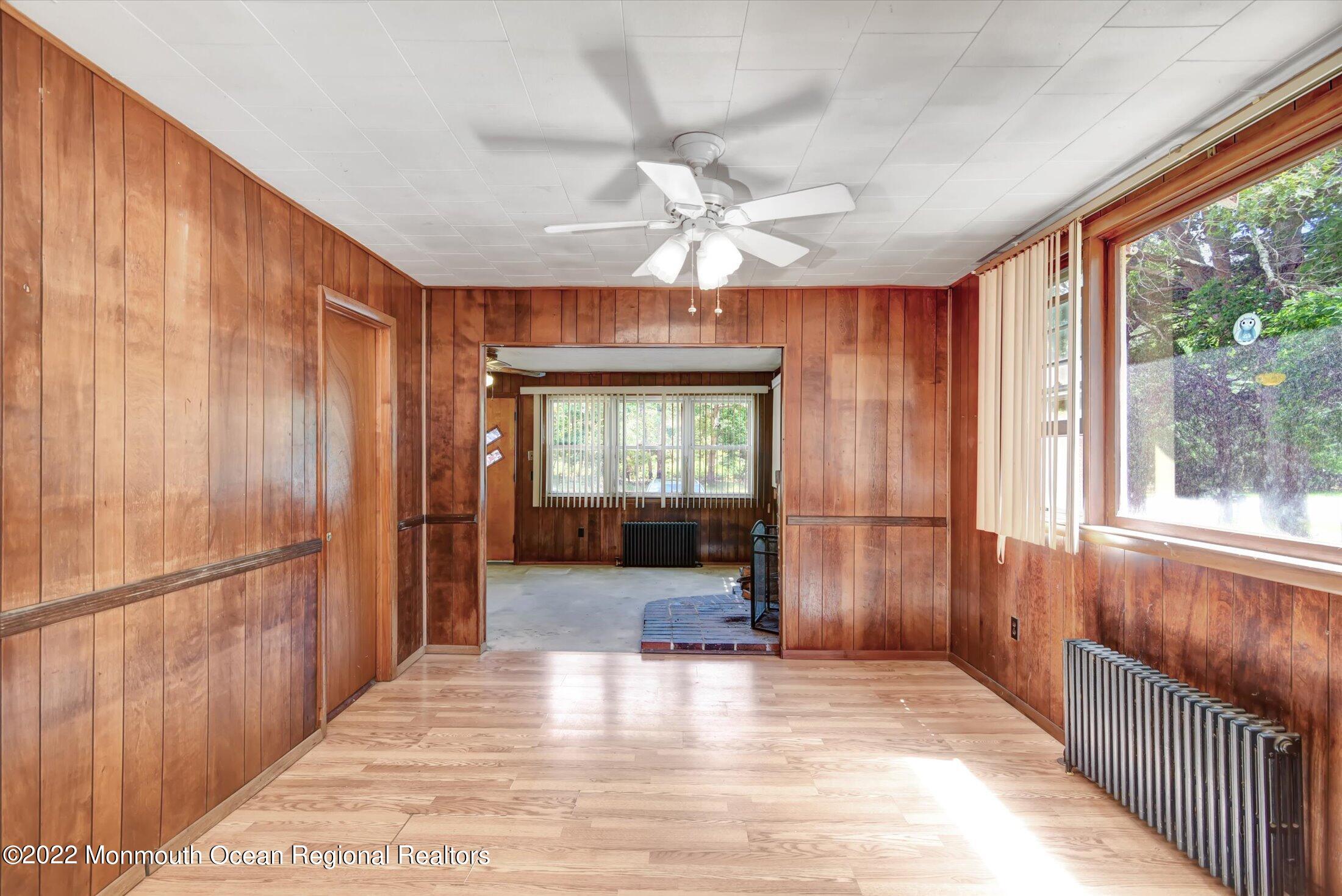 1350 Toms River Road Jackson, NJ 08527 - Photo 5 of 20 a view of a hallway with a chandelier fan and windows