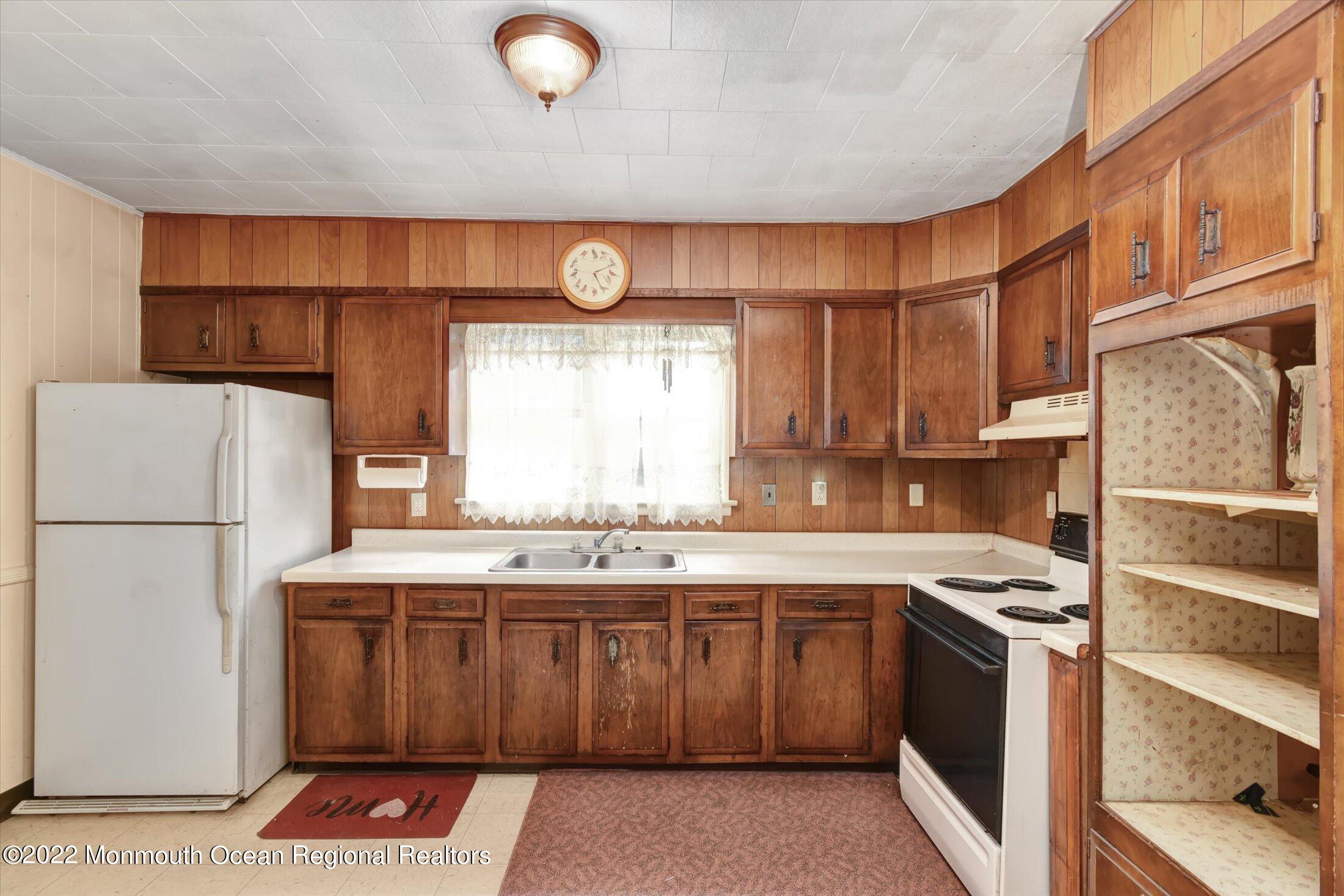 1350 Toms River Road Jackson, NJ 08527 - Photo 6 of 20 a kitchen with a stove a sink and a refrigerator