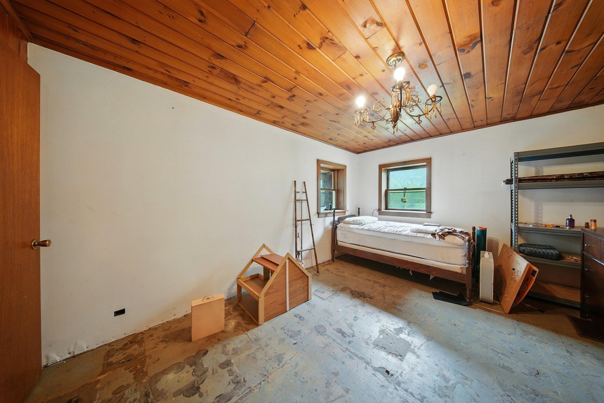 251 Haring Road Barryville, NY 12719 - Photo 13 of 30 Bedroom featuring a chandelier and wooden ceiling