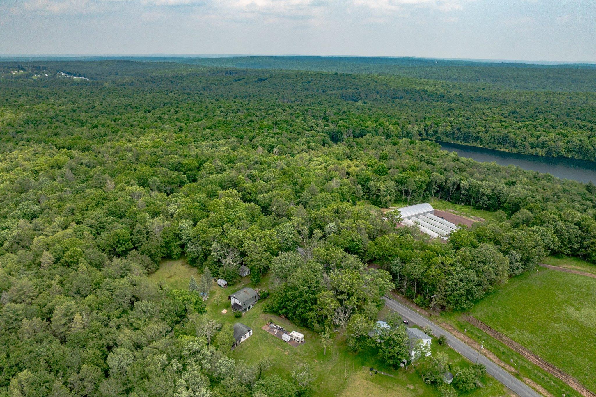 251 Haring Road Barryville, NY 12719 - Photo 24 of 30 Aerial view of property's location featuring a forest and a large body of water