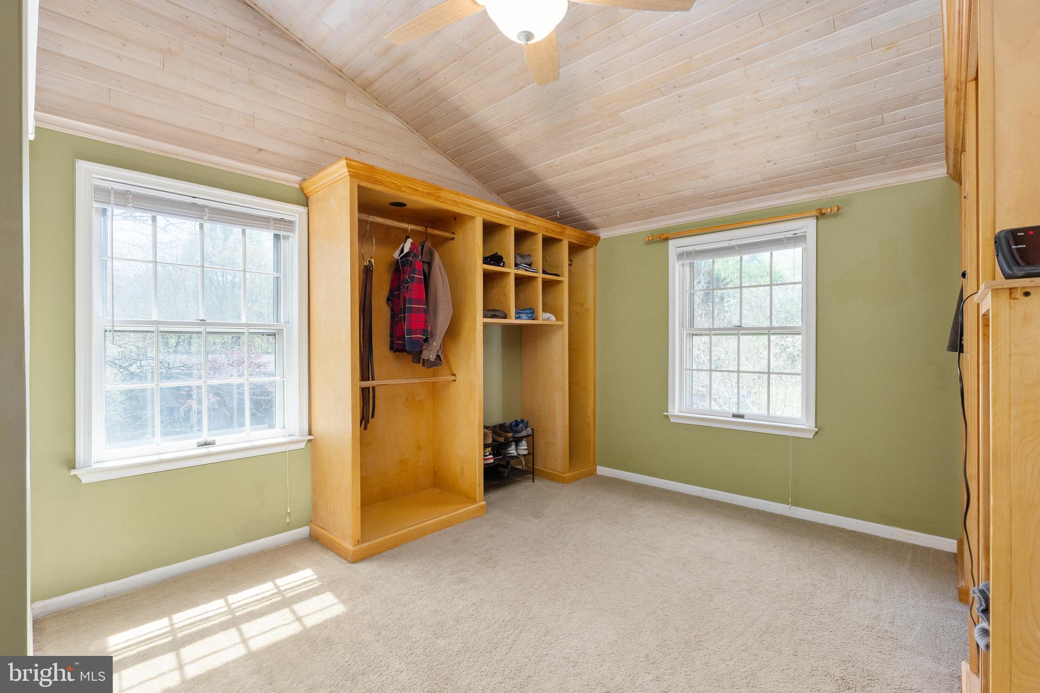 10802 Oldfield Drive Reston, VA 20191 - Photo 48 of 61 Custom Built-In Shelving and Wood Ceiling
