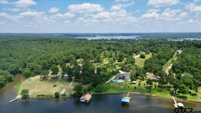 an aerial view of a houses with yard