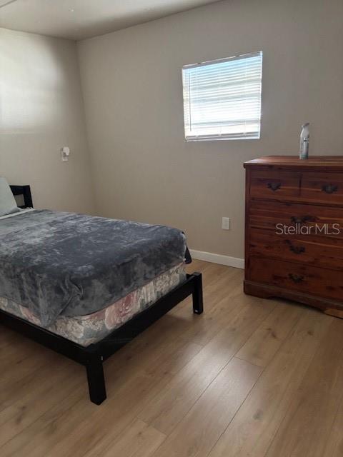 9145 Rally Lane Holiday, FL 34690 - Photo 14 of 14 a bedroom with a bed and a window