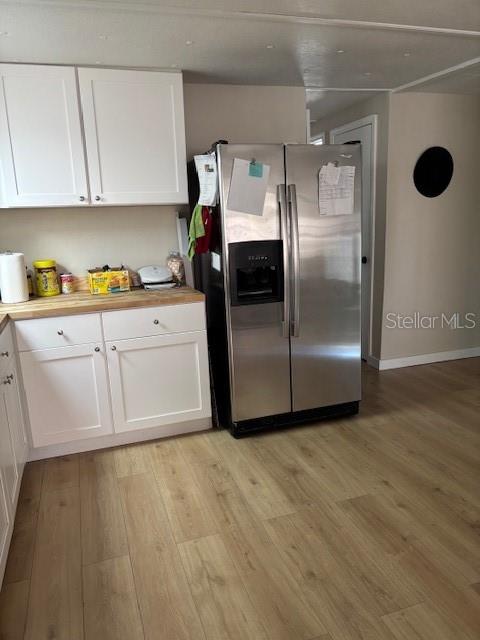 9145 Rally Lane Holiday, FL 34690 - Photo 10 of 14 a kitchen with granite countertop a refrigerator and a sink