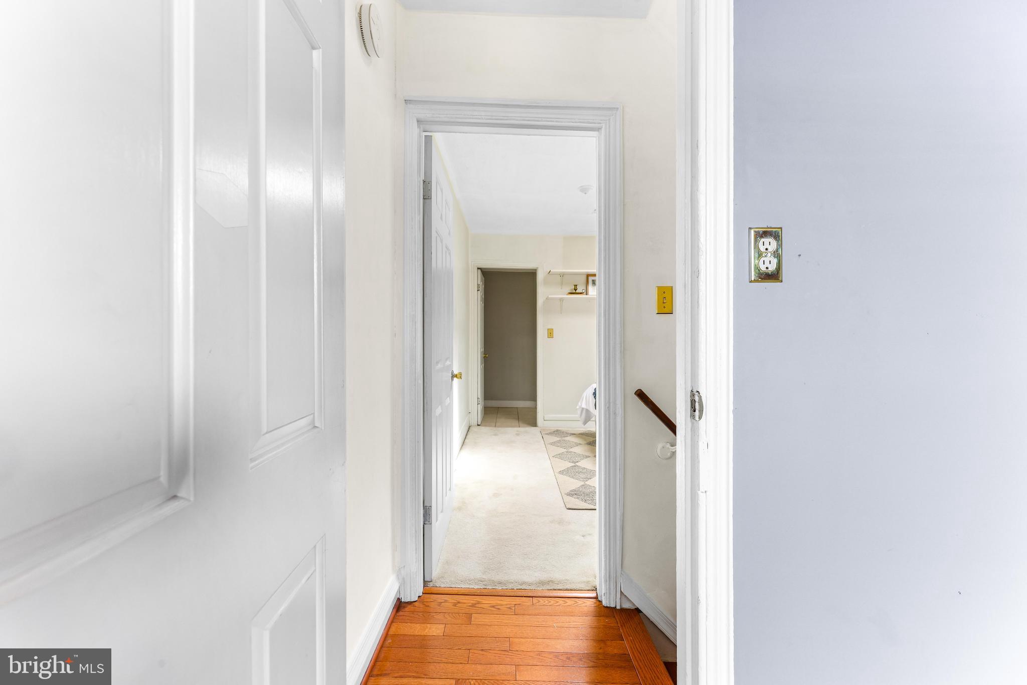1113 South Robinson Street Baltimore, MD 21224 - Photo 18 of 38 a view of a hallway with wooden floor