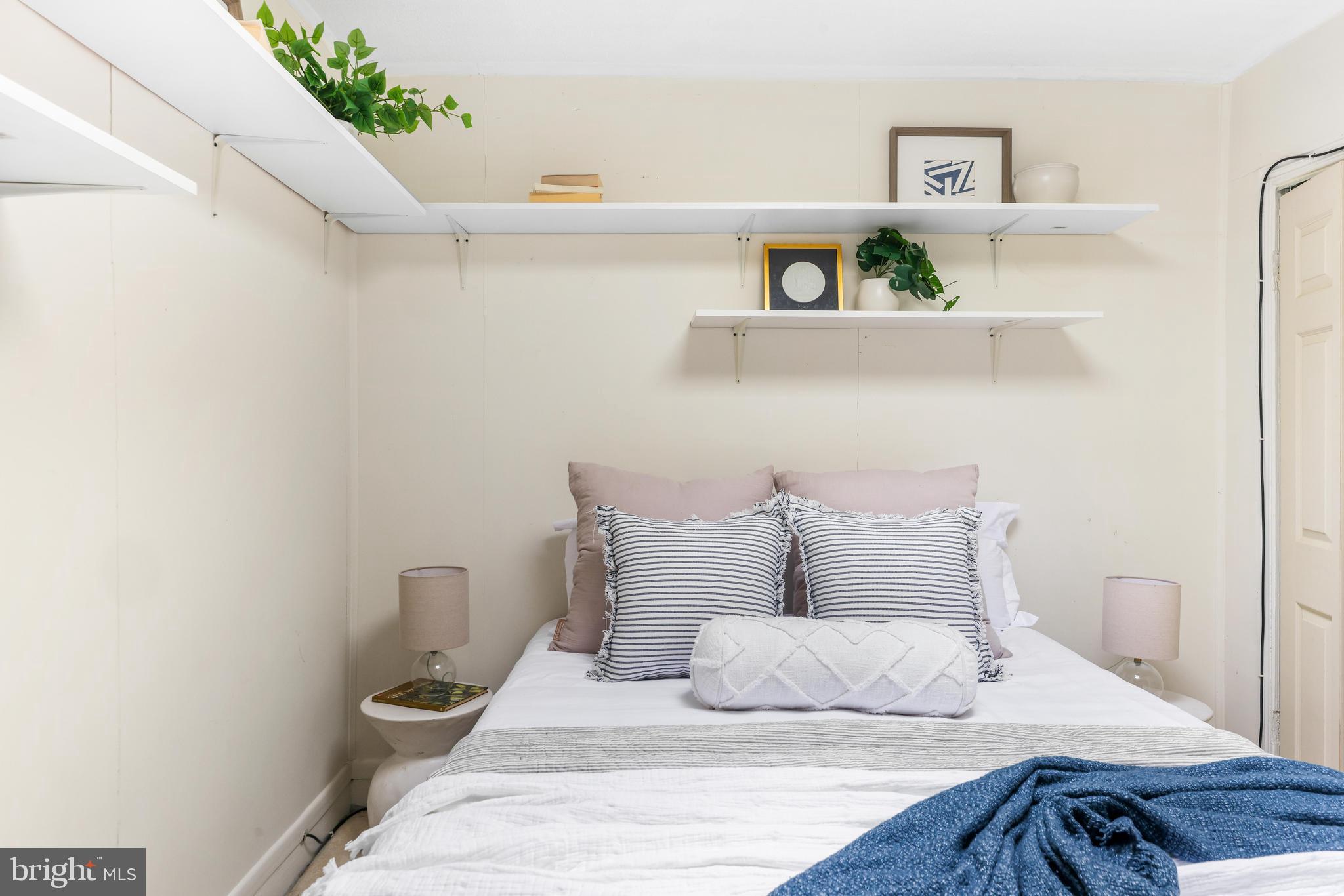 1113 South Robinson Street Baltimore, MD 21224 - Photo 20 of 38 a bedroom with a bed and closet