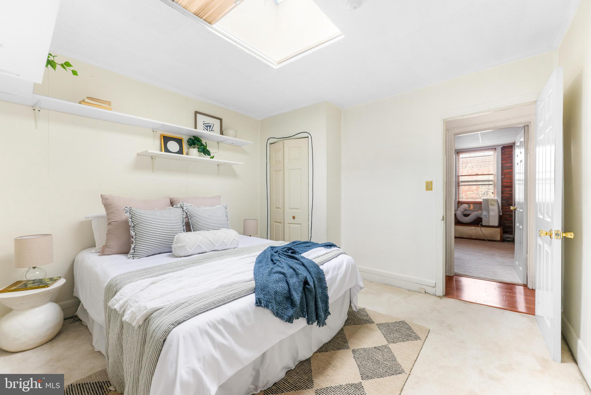 1113 South Robinson Street Baltimore, MD 21224 - Photo 21 of 38 a bedroom with a bed and a view of bathroom