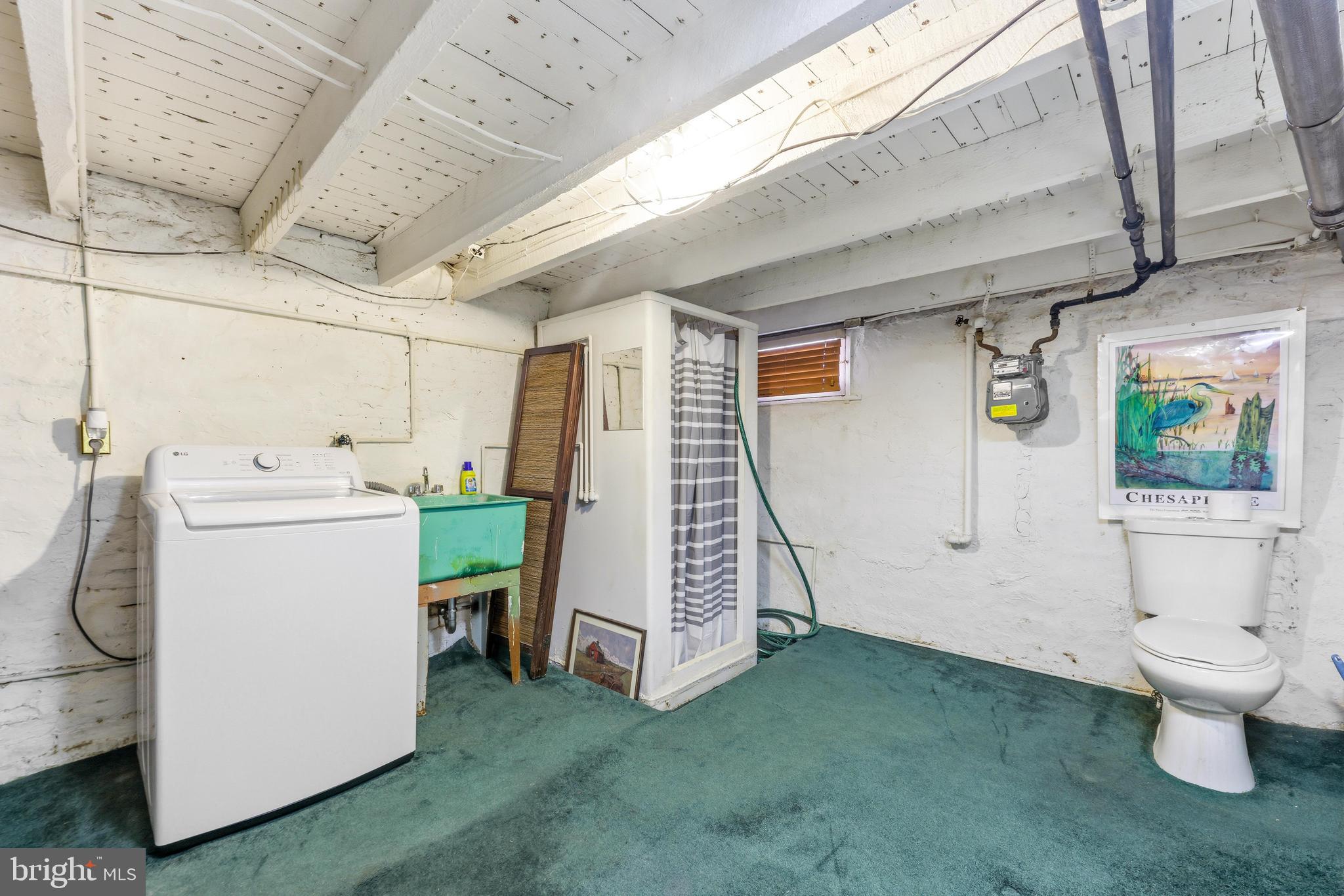 1113 South Robinson Street Baltimore, MD 21224 - Photo 26 of 38 a utility room with dryer and washer