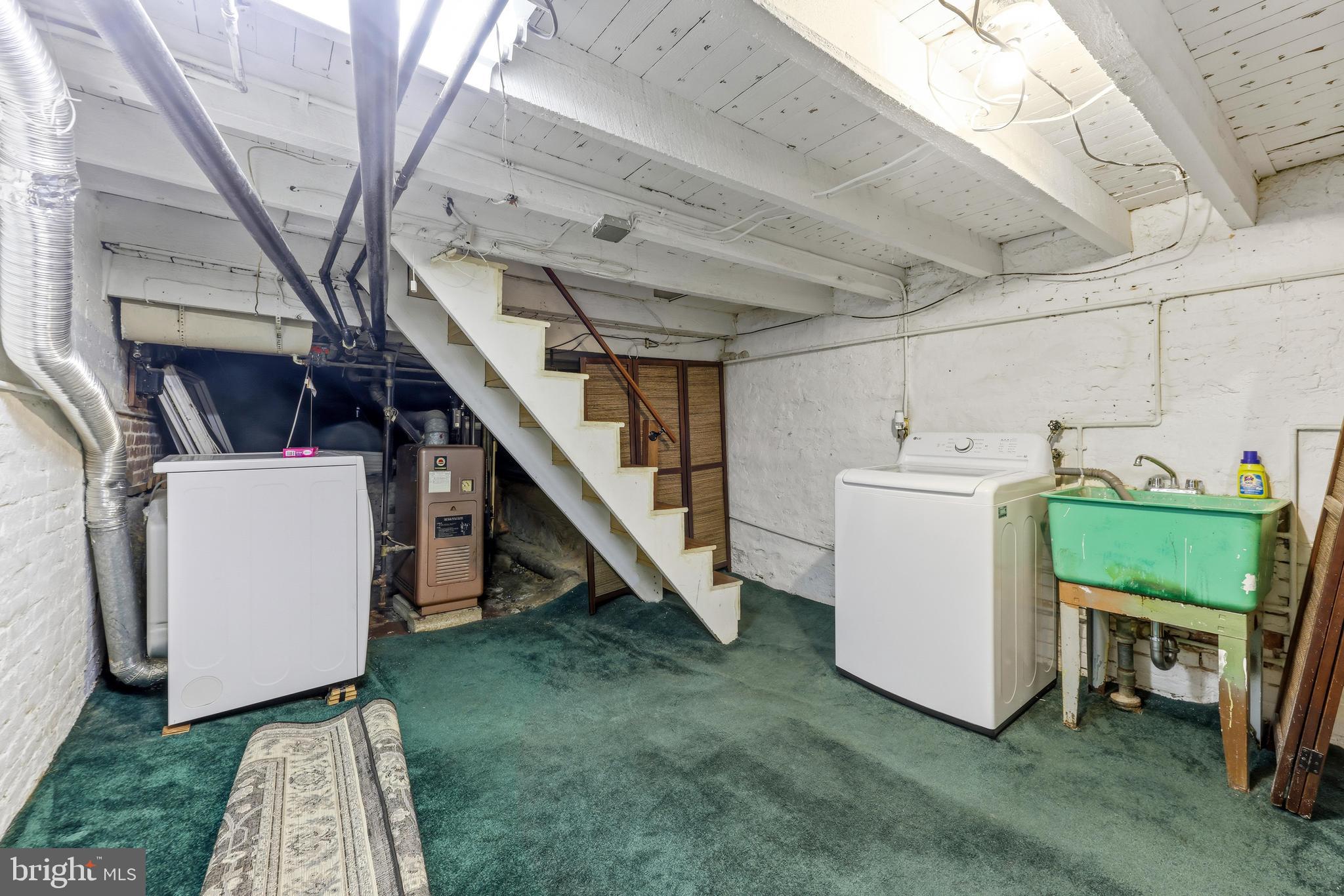 1113 South Robinson Street Baltimore, MD 21224 - Photo 27 of 38 a utility room with dryer and washer