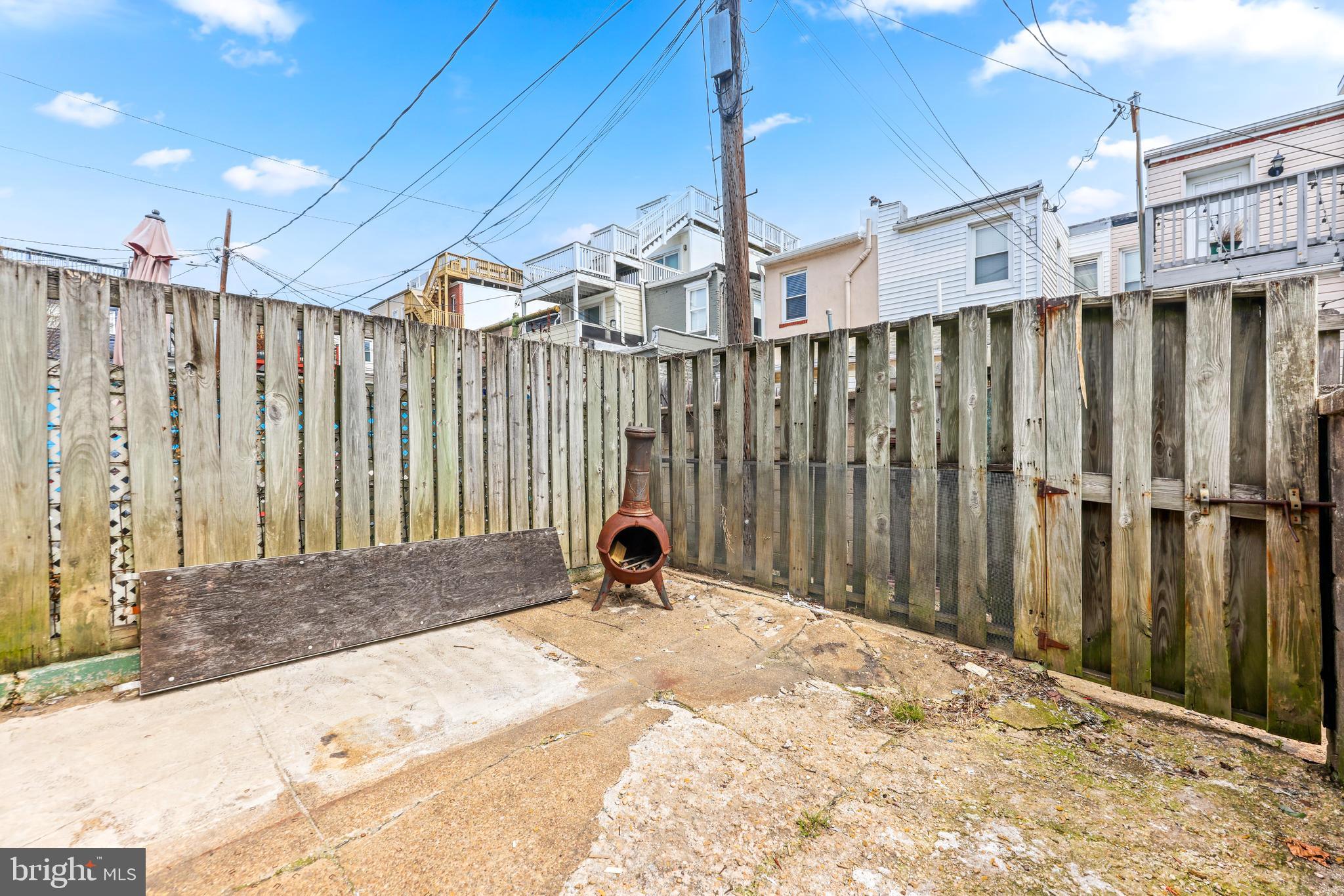 1113 South Robinson Street Baltimore, MD 21224 - Photo 30 of 38 a view of a backyard with wooden fence