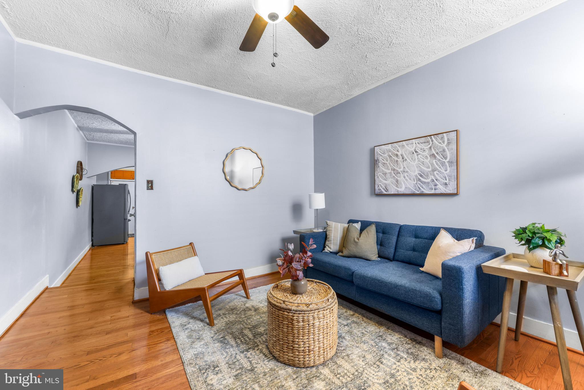 1113 South Robinson Street Baltimore, MD 21224 - Photo 5 of 38 a living room with furniture and wooden floor
