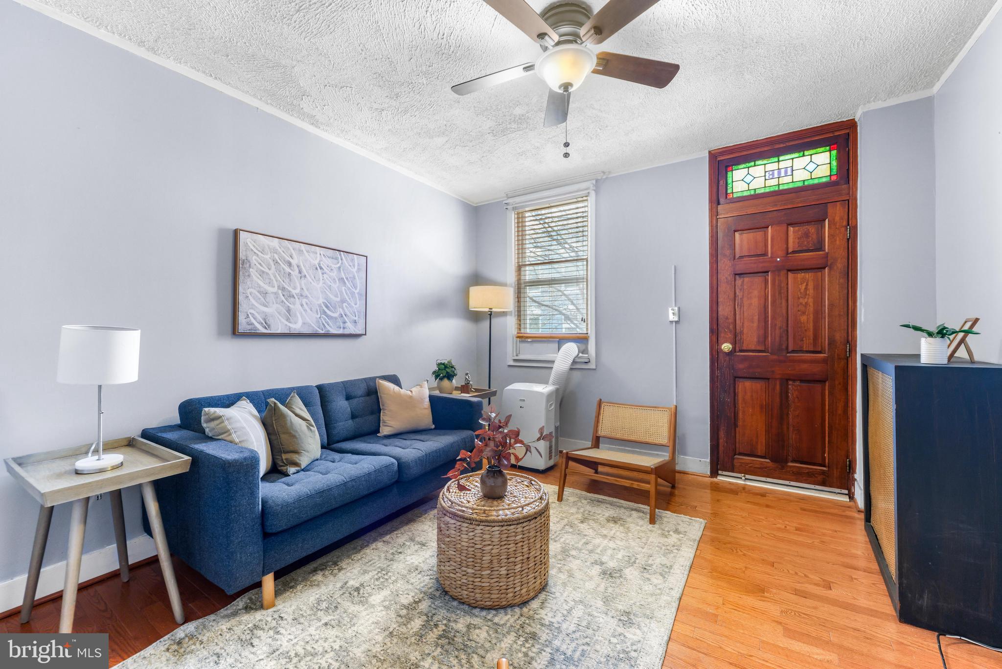 1113 South Robinson Street Baltimore, MD 21224 - Photo 6 of 38 a living room with furniture and a dining table