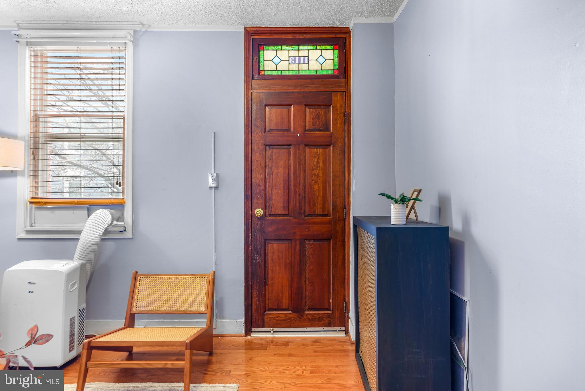 1113 South Robinson Street Baltimore, MD 21224 - Photo 7 of 38 a view of front door with wooden floor