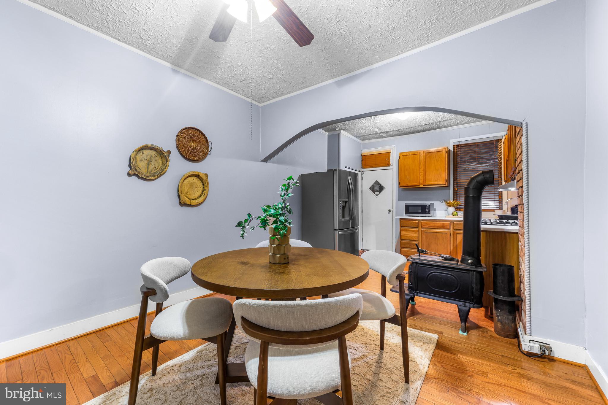 1113 South Robinson Street Baltimore, MD 21224 - Photo 8 of 38 a view of a dining room with furniture and wooden floor