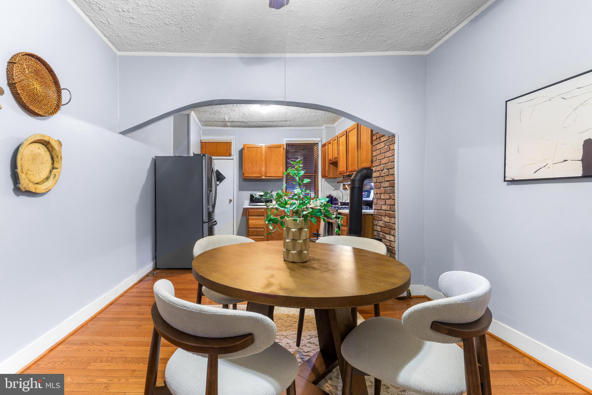 1113 South Robinson Street Baltimore, MD 21224 - Photo 9 of 38 a view of a dining room with furniture and a window
