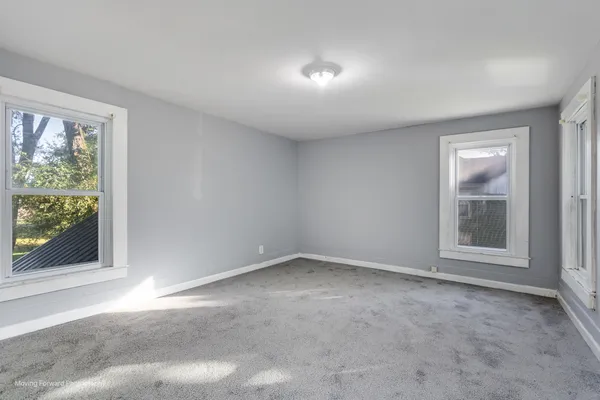 an empty room with windows
