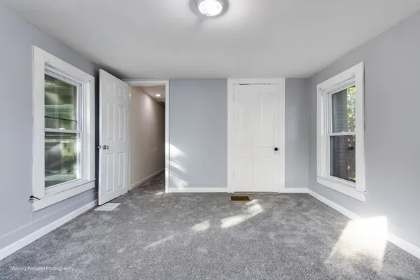 an empty room with windows