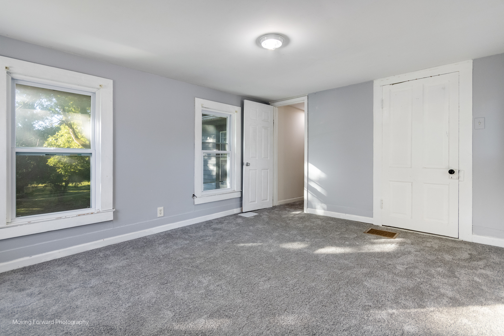 208 West Sycamore Street Millington, IL 60537 - Photo 18 of 19 a view of an empty room with glass door and a window