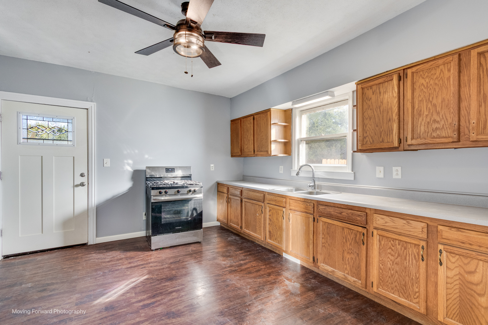 208 West Sycamore Street Millington, IL 60537 - Photo 10 of 19 a kitchen with granite countertop a stove cabinets and wooden floor